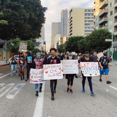 Photo of  Sal Stowers and other city members protesting for human right